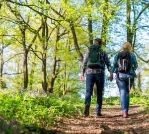 Photo of couple hiking on trail