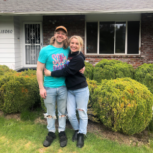clients in front of their new home