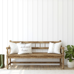 entryway with a wood bench and white pillows
